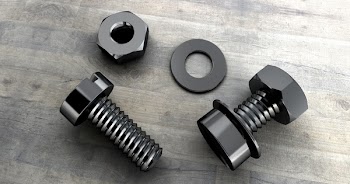 Two Black Metal Bolts on Gray Wooden Surface