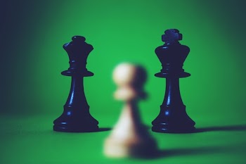 Two Black Queen and King Chess Pieces