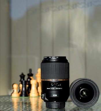 Two Black Zoom Lenses on Surface
