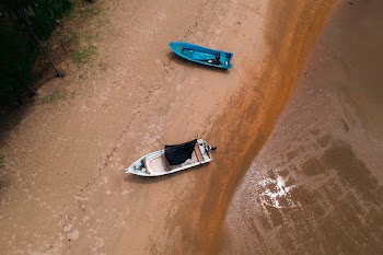 Two Blue and White Boats On Shore