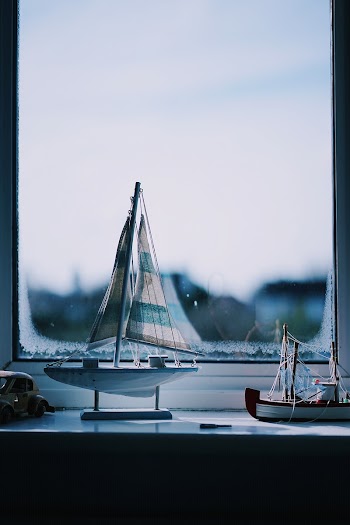 Two boats beside window. Original | Free Photo - rawpixel