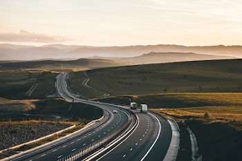 Two Box Trucks on Road