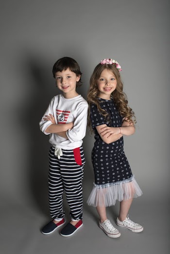 Two Boy and Girl Standing Wearing Clothe