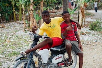 Two Boys Riding a Motorcycle
