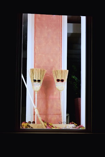 Two Brooms with Sunglasses