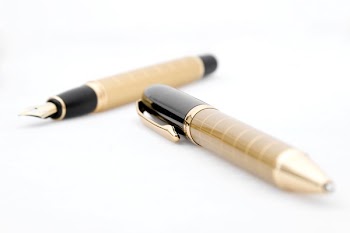 Two Brown-and-black Pen and Fountain Pen on White Background