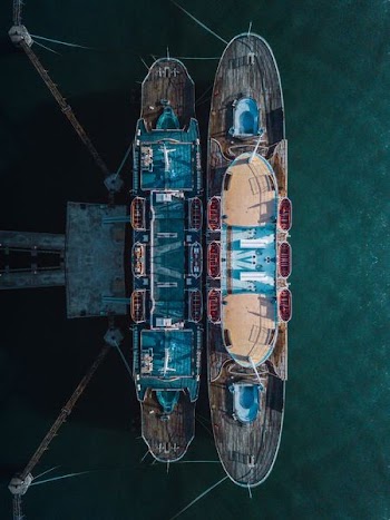 two brown-and-blue boat dock in aerial photography