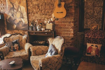 Two Brown Armchairs Near Brown Wooden Cabinet