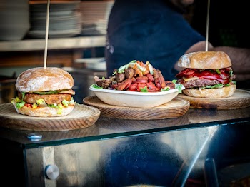Two Burgers and Viand on White Plate
