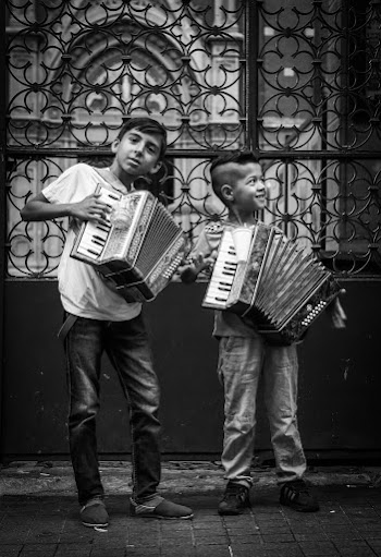 Two Children Playing Electronic Piano