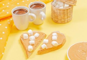 Two Chocolate Drinks Beside Peanut Butter Sandwich With White Marshmallows