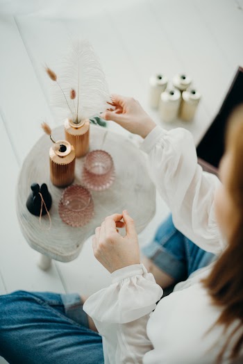 Two Clear Glass Bottles on White Table