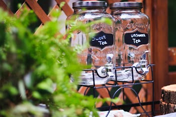 Two Clear Glass Jars On Black Rack