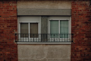 Two Closed Windows Between Walls