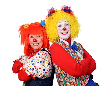 Two clown smiling isolated over a white background