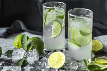 Two Drinking Glass With Lime Beverages