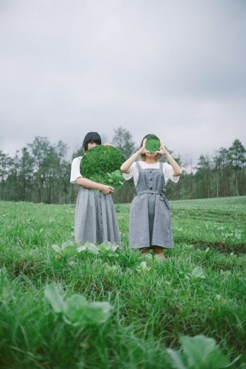 Two Girls Standing in Grass Field · Free Stock Photo
