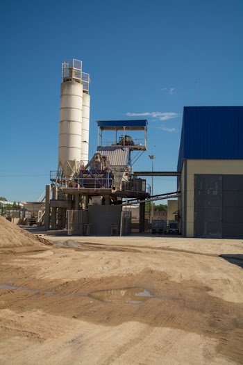 Two Gray Metal Water Tanks Near Building