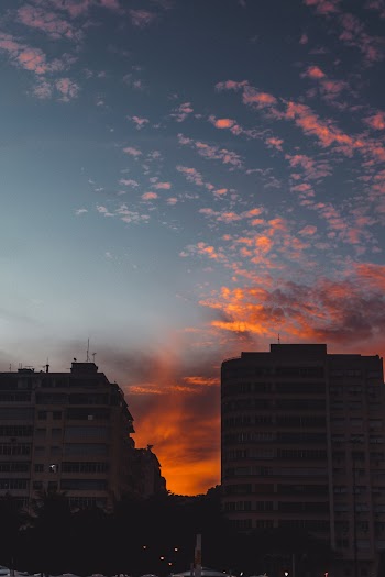 Two Grey High Rise Buildings during Golden Hour