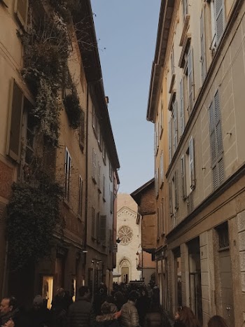 Two High Rise Buildings and People Between It