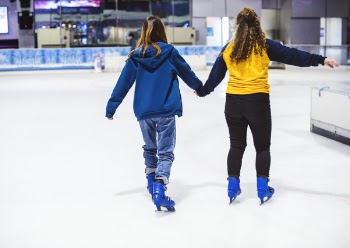 Two Man Holding Hands While Skating