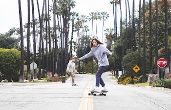Two Man Using Longboard