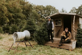 Two men by a Christmas | Free Photo - rawpixel