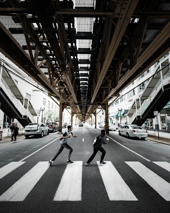 Two Men Crossing On Pedestrian Lane