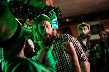 Two men fight in a bar.
