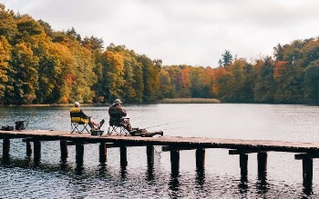 Two Men Fishing on Lake