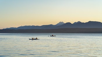 Two Men in Kayaks Out at Sea