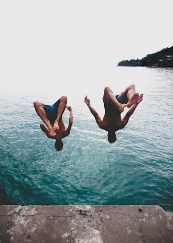 Two Men Jump on Sea