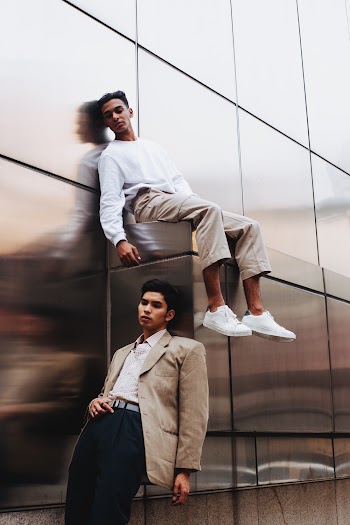 Two Men Leaning on Wall
