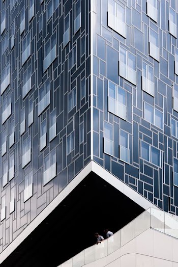 two men on building during daytime