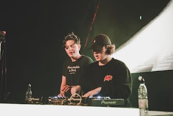 Two Men Playing Dj Mixer 