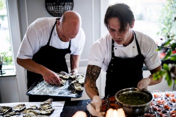 Two Men Preparing Food