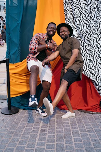 Two Men Raising Their Legs
