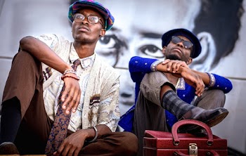 Two Men Sitting Looking Up