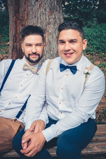 Two Men Sitting On Bench