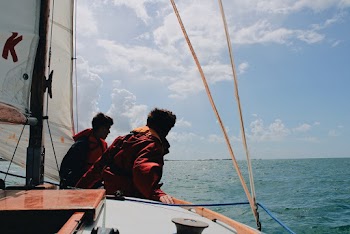 Two Men Sitting on Boat