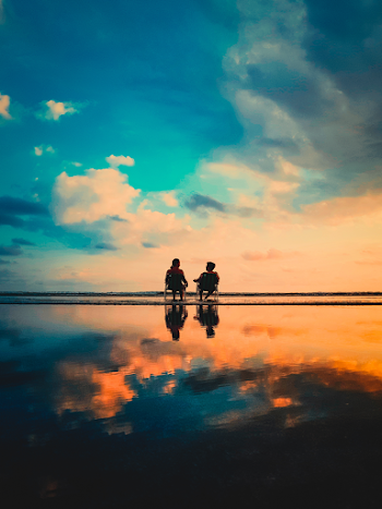 Two Men Sitting on Chairs