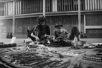 Two Men Sitting On Floor 