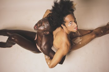 Two Men Sitting on Floor