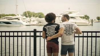 Two Men Standing Near Railing
