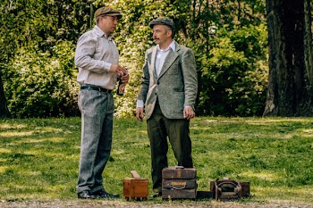 Two Men Standing Near Tree and Grasses