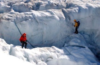 Two Men Standing on Snowy Ground