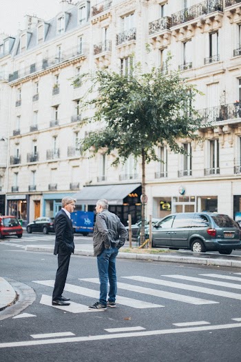 Two Men Talking to Each Other on Pedestrian Lane