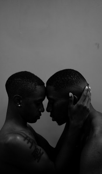 Two Men Touching Forehead