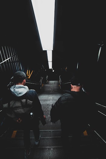 Two Men Walking Downstairs
