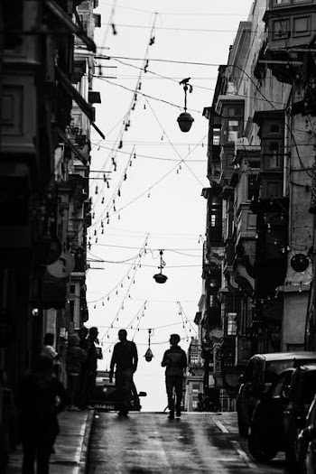 two men walking on street during daytime